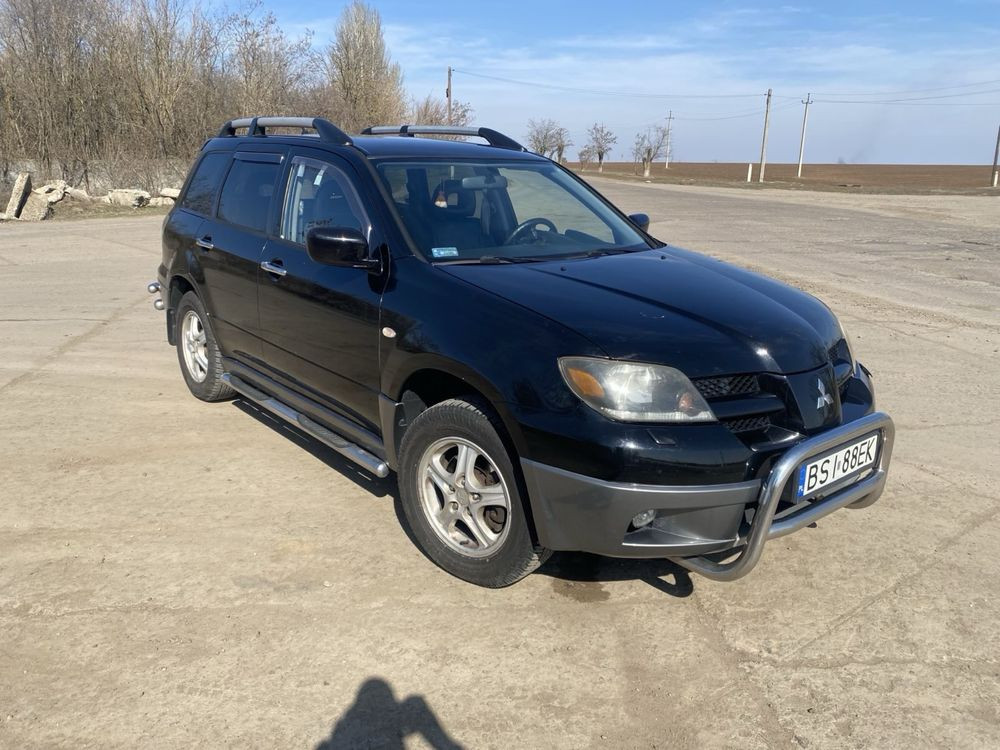 Mitsubishi Outlander бензин 2.0 Снежное - изображение 1